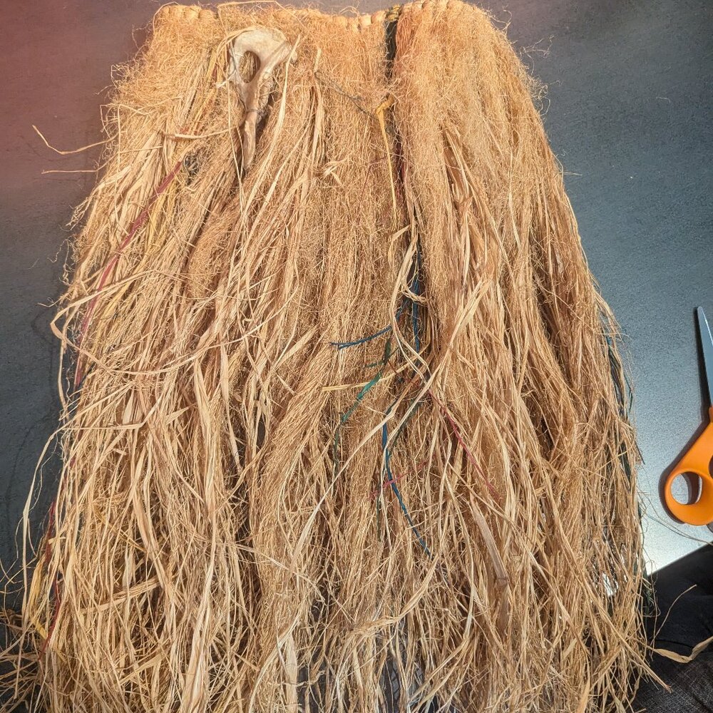 Versatile Grass Skirt with Spooky Accents